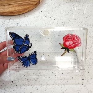 Transparent clutch with embroidery patches